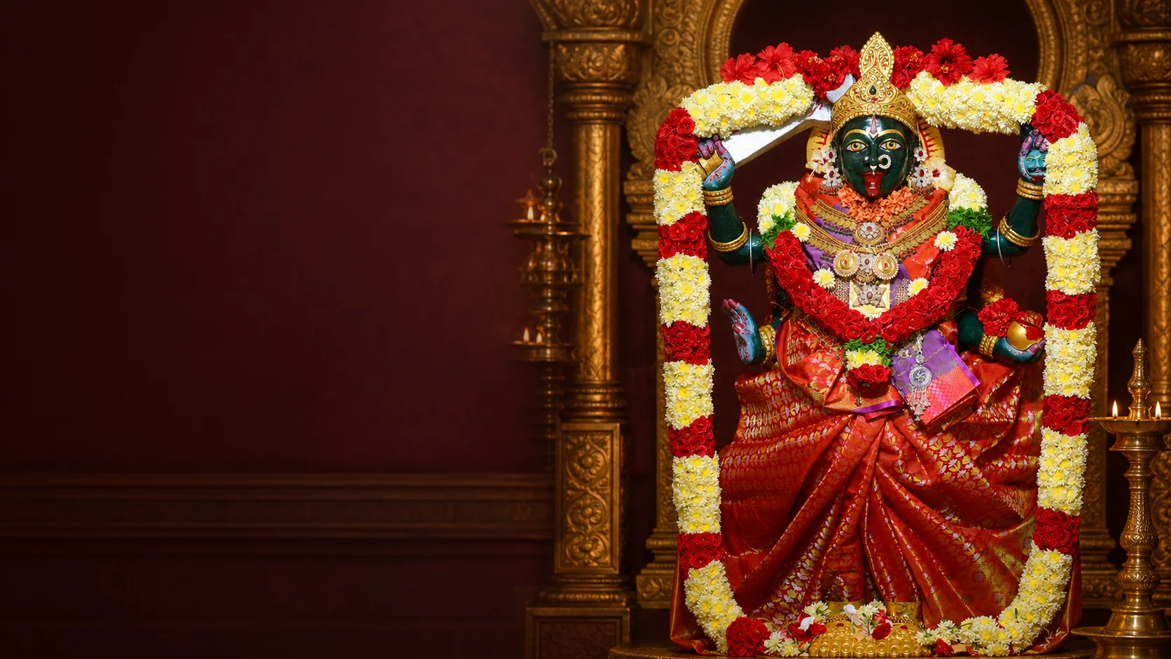 Sri Marakatha Sakthi Kaali Devi in a lamp-lit sanctum